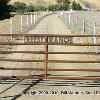 small steel ranch sign. welded to gate.